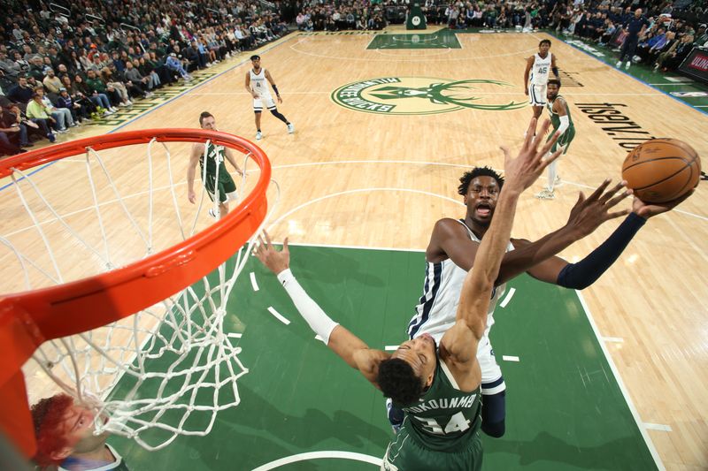 MILWAUKEE, WI - APRIL 3: Jaren Jackson Jr. #13 of the Memphis Grizzlies drives to the basket during the game against the Milwaukee Bucks on April 3, 2024 at the Fiserv Forum Center in Milwaukee, Wisconsin. NOTE TO USER: User expressly acknowledges and agrees that, by downloading and or using this Photograph, user is consenting to the terms and conditions of the Getty Images License Agreement. Mandatory Copyright Notice: Copyright 2024 NBAE (Photo by Gary Dineen/NBAE via Getty Images).