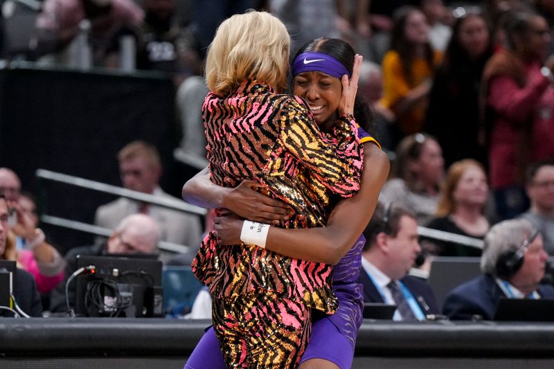 Apr 2, 2023; Dallas, TX, USA; LSU Lady Tigers guard Flau'jae Johnson (4) hugs head coach Kim Mulkey after defeating the Iowa Hawkeyes during the final round of the Women's Final Four NCAA tournament at the American Airlines Center. Mandatory Credit: Kirby Lee-USA TODAY Sports