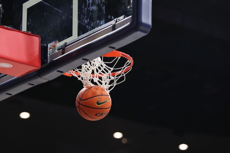 Jan 5, 2023; Tucson, Arizona, USA; An Arizona Wildcats basketball goes through the net at McKale Center. Mandatory Credit: Zachary BonDurant-USA TODAY Sports