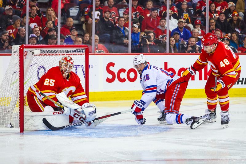 Oct 24, 2023; Calgary, Alberta, CAN; Calgary Flames defenseman Dennis Gilbert (48) pulls out New York Rangers center Vincent Trocheck (16) out of Calgary Flames goaltender Jacob Markstrom (25) net during the third period at Scotiabank Saddledome. Mandatory Credit: Sergei Belski-USA TODAY Sports