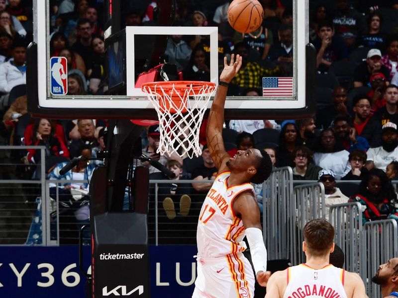 ATLANTA, GA - JANUARY 26: Onyeka Okongwu #17 of the Atlanta Hawks rebounds the ball during the game against the Dallas Mavericks on January 26, 2024 at State Farm Arena in Atlanta, Georgia.  NOTE TO USER: User expressly acknowledges and agrees that, by downloading and/or using this Photograph, user is consenting to the terms and conditions of the Getty Images License Agreement. Mandatory Copyright Notice: Copyright 2024 NBAE (Photo by Scott Cunningham/NBAE via Getty Images)