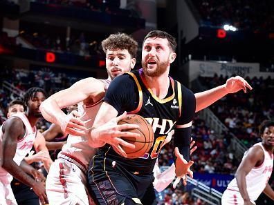 HOUSTON, TX - DECEMBER 27:   Jusuf Nurkic #20 of the Phoenix Suns handles the ball during the game against the Houston Rockets on December 27, 2023 at the Toyota Center in Houston, Texas. NOTE TO USER: User expressly acknowledges and agrees that, by downloading and or using this photograph, User is consenting to the terms and conditions of the Getty Images License Agreement. Mandatory Copyright Notice: Copyright 2023 NBAE (Photo by Logan Riely/NBAE via Getty Images)