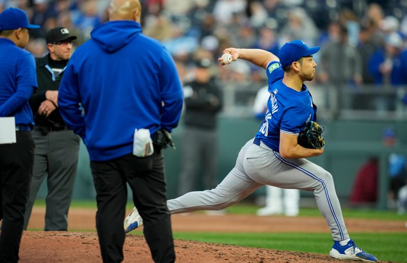 Apr 22, 2024; Kansas City, Missouri, USA; Toronto Blue Jays pitcher Yusei Kikuchi (16) warms up after being hit with a ground ball during the second inning against the Kansas City Royals at Kauffman Stadium. Mandatory Credit: Jay Biggerstaff-USA TODAY Sports