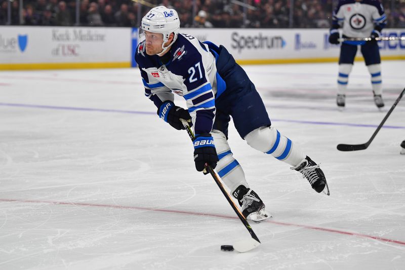 Dec 13, 2023; Los Angeles, California, USA; Winnipeg Jets left wing Nikolaj Ehlers (27) moves in for a shot against the Los Angeles Kings during the first period at Crypto.com Arena. Mandatory Credit: Gary A. Vasquez-USA TODAY Sports