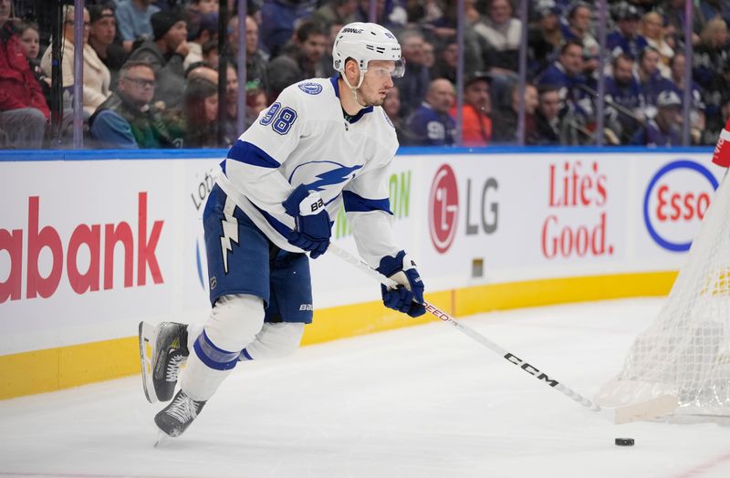 Nov 6, 2023; Toronto, Ontario, CAN; Tampa Bay Lightning defenseman Mikhail Sergachev (98) carries the puck against the Toronto Maple Leafs during the first period at Scotiabank Arena. Mandatory Credit: John E. Sokolowski-USA TODAY Sports