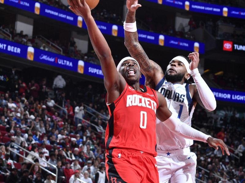 HOUSTON, TX - JANUARY 01   Aaron Holiday #0 of the Houston Rockets shoots the ball during the game against the Dallas Mavericks on January 01, 2025 at the Toyota Center in Houston, Texas. NOTE TO USER: User expressly acknowledges and agrees that, by downloading and or using this photograph, User is consenting to the terms and conditions of the Getty Images License Agreement. Mandatory Copyright Notice: Copyright 2025 NBAE (Photo by Logan Riely/NBAE via Getty Images)