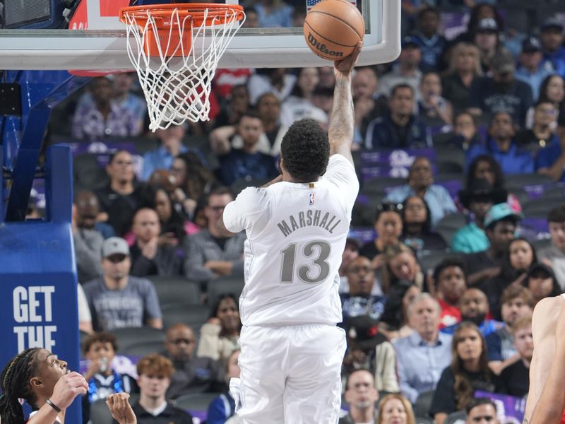 DALLAS, TX - MARCH 7: Naji Marshall #13 of the Dallas Mavericks drives to the basket during the game against the Memphis Grizzlies on March 7, 2025 at American Airlines Center in Dallas, Texas. NOTE TO USER: User expressly acknowledges and agrees that, by downloading and or using this photograph, User is consenting to the terms and conditions of the Getty Images License Agreement. Mandatory Copyright Notice: Copyright 2025 NBAE (Photo by Glenn James/NBAE via Getty Images)