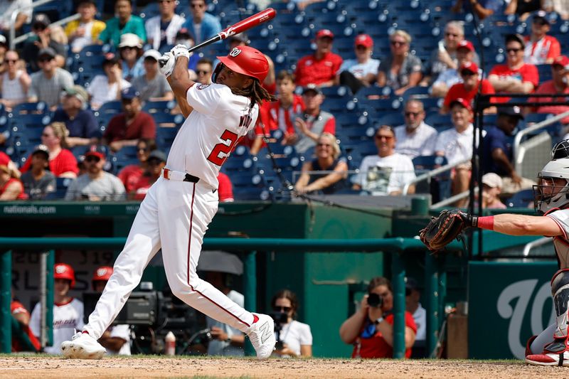 Jul 21, 2024; Washington, District of Columbia, USA; Washington Nationals outfielder James Wood (29) hits a go ahead three run home run against the Cincinnati Reds during the eighth inning at Nationals Park. Mandatory Credit: Geoff Burke-USA TODAY Sports