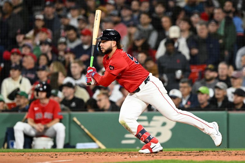 Sep 20, 2024; Boston, Massachusetts, USA; Boston Red Sox right fielder Wilyer Abreu (52) hits a single against the Minnesota Twins during the fourth inning at Fenway Park. Mandatory Credit: Brian Fluharty-Imagn Images