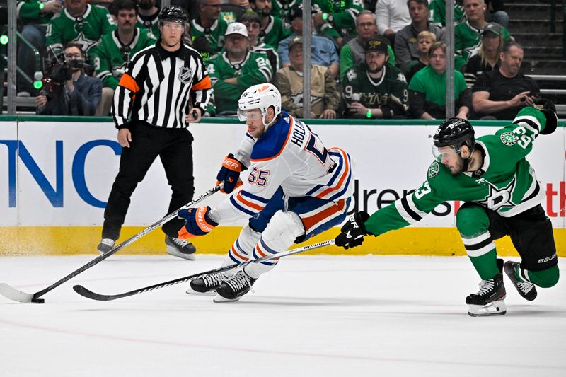 May 25, 2024; Dallas, Texas, USA; Edmonton Oilers left wing Dylan Holloway (55) skates past Dallas Stars right wing Evgenii Dadonov (63) during the first period in game two of the Western Conference Final of the 2024 Stanley Cup Playoffs at American Airlines Center. Mandatory Credit: Jerome Miron-USA TODAY Sports