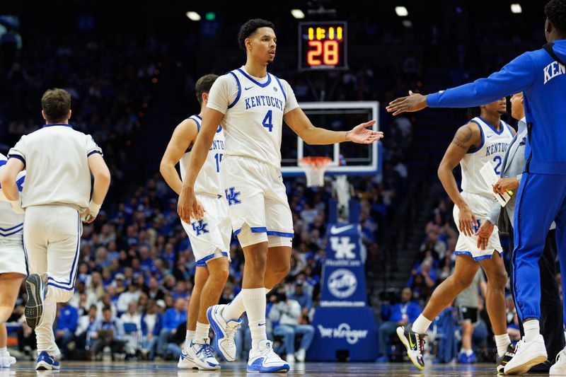 Nov 10, 2023; Lexington, Kentucky, USA; Kentucky Wildcats forward Tre Mitchell (4) returns to the bench during a timeout in the second half against the Texas A&M Commerce Lions at Rupp Arena at Central Bank Center. Mandatory Credit: Jordan Prather-USA TODAY Sports