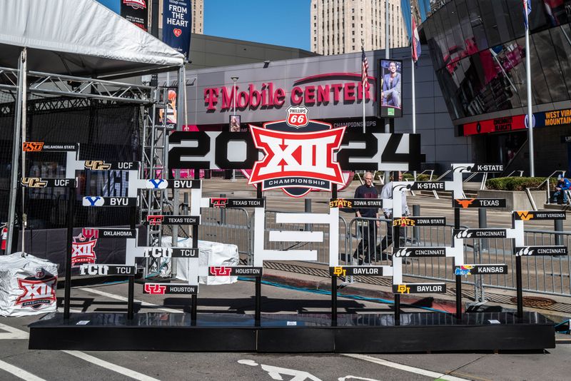 Mar 15, 2024; Kansas City, MO, USA; Tournament bracket in the Big 12 Experience fan area outside the entrance to the arena at T-Mobile Center. Mandatory Credit: William Purnell-USA TODAY Sports