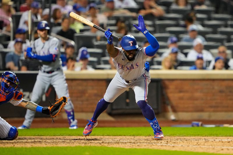 Aug 30, 2023; New York City, New York, USA; Texas Rangers right fielder Adolis Garcia (53) gets hit by a pitch against the New York Mets during the eighth inning at Citi Field. Mandatory Credit: Gregory Fisher-USA TODAY Sports