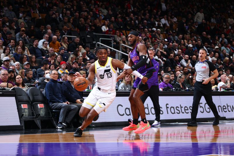 TORONTO, CANADA - MARCH 7: Isaiah Collier #13 of the Utah Jazz handles the ball during the game against the Toronto Raptors  on March 7, 2025 at the Scotiabank Arena in Toronto, Ontario, Canada.  NOTE TO USER: User expressly acknowledges and agrees that, by downloading and or using this Photograph, user is consenting to the terms and conditions of the Getty Images License Agreement.  Mandatory Copyright Notice: Copyright 2025 NBAE (Photo by Vaughn Ridley/NBAE via Getty Images)