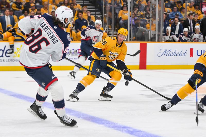 Oct 9, 2025; Nashville, Tennessee, USA; Nashville Predators left wing Erik Haula (56) blocks the pass of Columbus Blue Jackets right wing Kirill Marchenko (86) during the second period at Bridgestone Arena. Mandatory Credit: Steve Roberts-Imagn Images