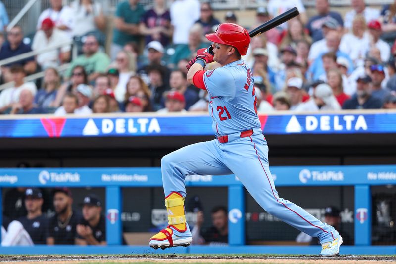 Aug 24, 2024; Minneapolis, Minnesota, USA; St. Louis Cardinals right fielder Lars Nootbaar (21) hits a double against the Minnesota Twins during the second inning at Target Field. Mandatory Credit: Matt Krohn-USA TODAY Sports