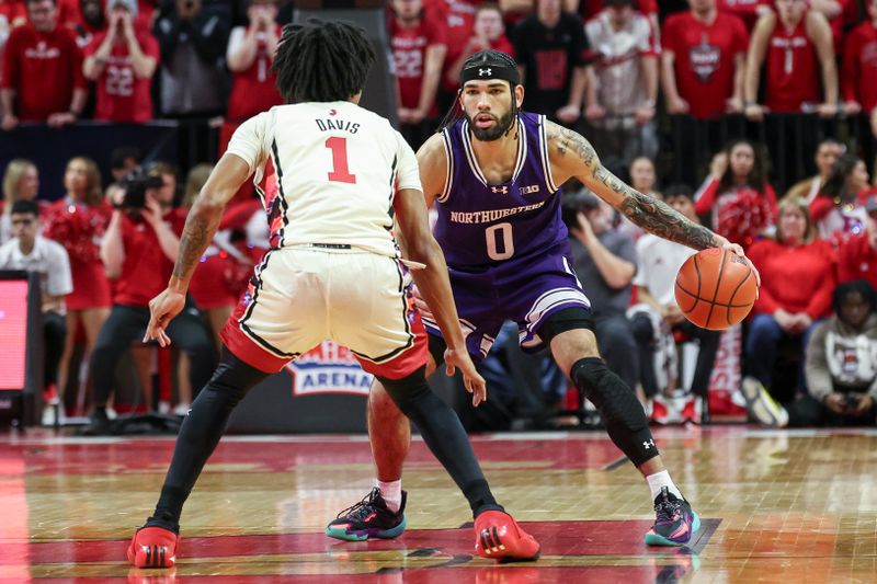 Feb 15, 2024; Piscataway, New Jersey, USA; Northwestern Wildcats guard Boo Buie (0) dribbles against Rutgers Scarlet Knights guard Jamichael Davis (1) during the first half at Jersey Mike's Arena. Mandatory Credit: Vincent Carchietta-USA TODAY Sports