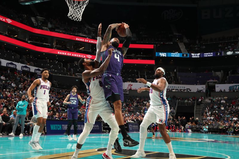 CHARLOTTE, NC - DECEMBER 3: Nick Richards #4 of the Charlotte Hornets handles the ball during the game against the Philadelphia 76ers during an NBA Emirates Cup game on December 3, 2024 at Spectrum Center in Charlotte, North Carolina. NOTE TO USER: User expressly acknowledges and agrees that, by downloading and or using this photograph, User is consenting to the terms and conditions of the Getty Images License Agreement. Mandatory Copyright Notice: Copyright 2024 NBAE (Photo by Kent Smith/NBAE via Getty Images)