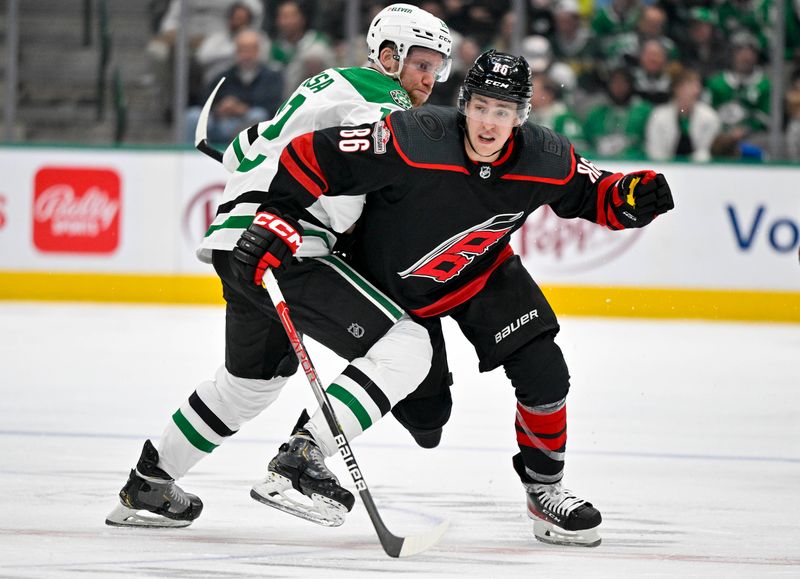 Jan 25, 2023; Dallas, Texas, USA; Carolina Hurricanes left wing Teuvo Teravainen (86) skates past Dallas Stars center Radek Faksa (12) during the third period at the American Airlines Center. Mandatory Credit: Jerome Miron-USA TODAY Sports