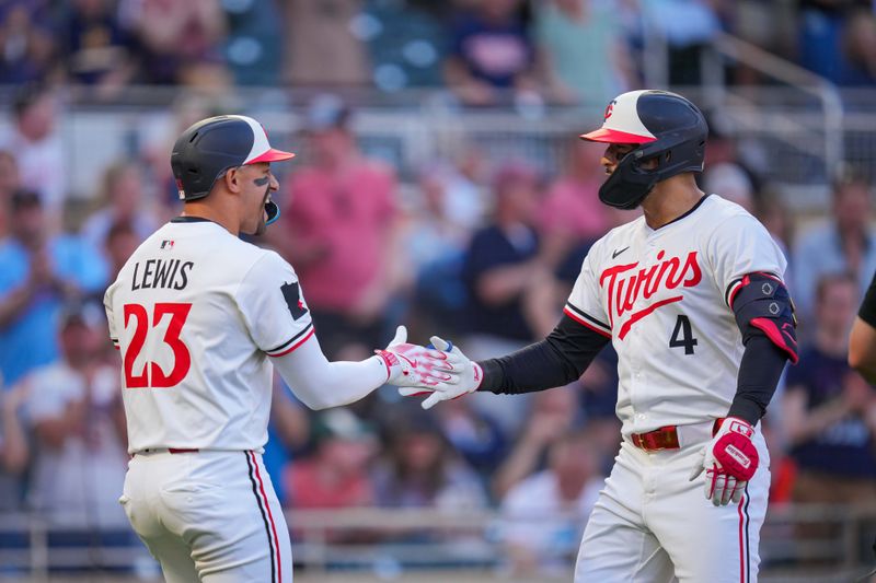 May 6, 2025; Minneapolis, Minnesota, USA; Minnesota Twins shortstop Carlos Correa (4) celebrates hitting a home run with designated hitter Royce Lewis (23) against the Baltimore Orioles in the third inning at Target Field. Mandatory Credit: Brad Rempel-Imagn Images
