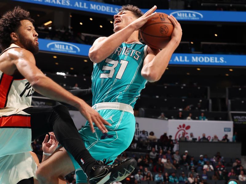 CHARLOTTE, NC - NOVEMBER 21: Tidjane Salaun #31 of the Charlotte Hornets drives to the basket during the game against the Detroit Pistons on November 21, 2024 at Spectrum Center in Charlotte, North Carolina. NOTE TO USER: User expressly acknowledges and agrees that, by downloading and or using this photograph, User is consenting to the terms and conditions of the Getty Images License Agreement. Mandatory Copyright Notice: Copyright 2024 NBAE (Photo by Kent Smith/NBAE via Getty Images)