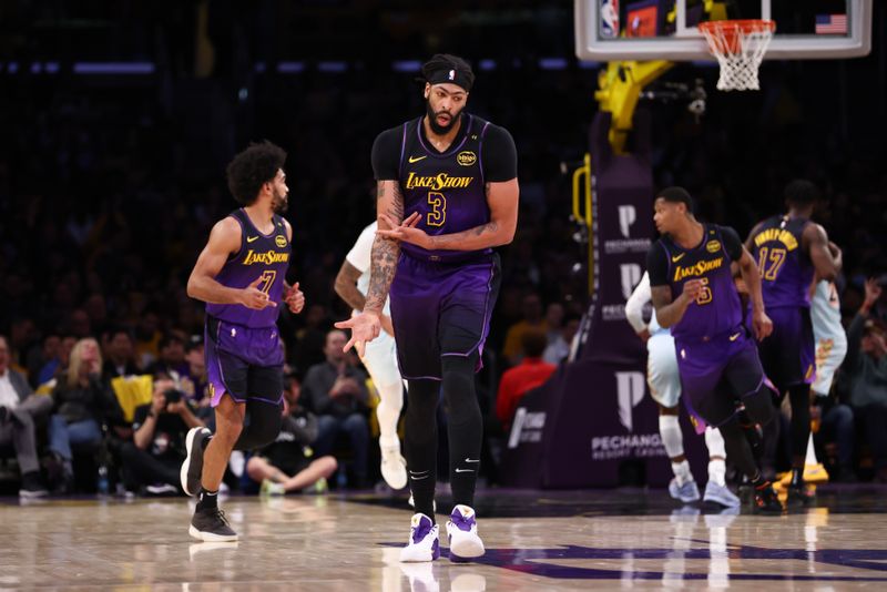 LOS ANGELES, CALIFORNIA - JANUARY 13: Anthony Davis #3 of the Los Angeles Lakers reacts after a three-point basket during the second half against the San Antonio Spurs at Crypto.com Arena on January 13, 2025 in Los Angeles, California. NOTE TO USER: User expressly acknowledges and agrees that, by downloading and/or using this Photograph, user is consenting to the terms and conditions of the Getty Images License Agreement.  (Photo by Katelyn Mulcahy/Getty Images)