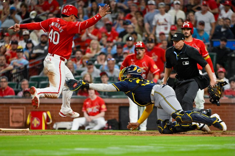 Apr 25, 2025; St. Louis, Missouri, USA;  Milwaukee Brewers catcher William Contreras (24) tags out St. Louis Cardinals first baseman Willson Contreras (40) during the fifth inning at Busch Stadium. Mandatory Credit: Jeff Curry-Imagn Images