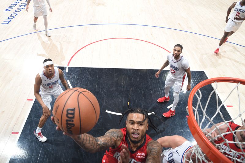 LOS ANGELES, CA - APIRL 14: Cam Whitmore #7 of the Houston Rockets drives to the basket during the game against the LA Clippers on April 14, 2024 at Crypto.Com Arena in Los Angeles, California. NOTE TO USER: User expressly acknowledges and agrees that, by downloading and/or using this Photograph, user is consenting to the terms and conditions of the Getty Images License Agreement. Mandatory Copyright Notice: Copyright 2024 NBAE (Photo by Adam Pantozzi/NBAE via Getty Images)