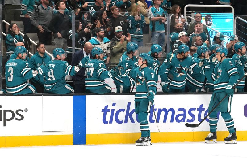 Nov 8, 2025; San Jose, California, USA; San Jose Sharks center Macklin Celebrini (71) celebrates with teammates after scoring a goal against the Florida Panthers during the first period at SAP Center at San Jose. Mandatory Credit: Darren Yamashita-Imagn Images
