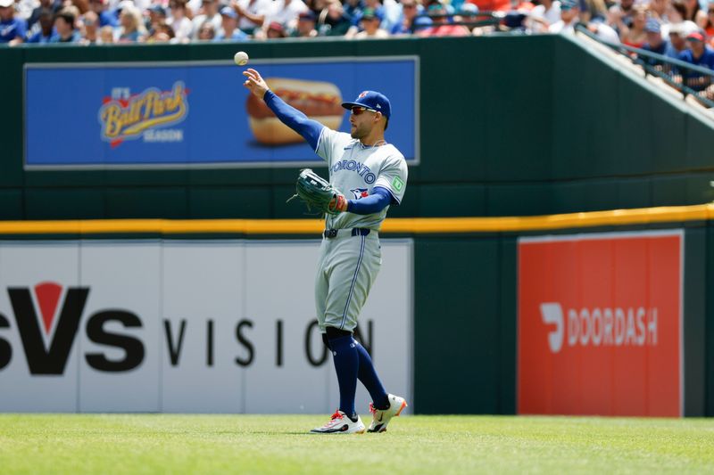 May 25, 2024; Detroit, Michigan, USA; Toronto Blue Jays outfielder George Springer (4) throws to the infield during the first inning of the game against the Detroit Tigers at Comerica Park. Mandatory Credit: Brian Bradshaw Sevald-USA TODAY Sports