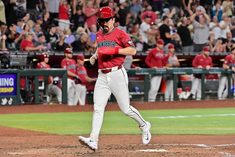 May 15, 2024; Phoenix, Arizona, USA;  Arizona Diamondbacks outfielder Corbin Carroll (7) scores in the eighth inning against the Cincinnati Reds at Chase Field. Mandatory Credit: Matt Kartozian-USA TODAY Sports