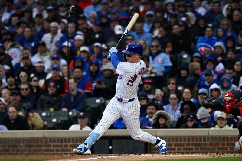Mar 26, 2026; Chicago, Illinois, USA;  Chicago Cubs center fielder Pete Crow-Armstrong (4) hits a RBI single against then Washington Nationals during the third inning at Wrigley Field. Mandatory Credit: Matt Marton-Imagn Images