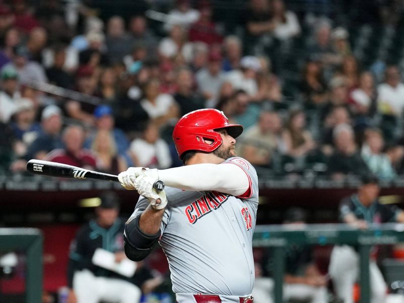 May 13, 2024; Phoenix, Arizona, USA; Cincinnati Reds designated hitter Mike Ford (38) hits an RBI single against the Arizona Diamondbacks during the sixth inning at Chase Field. Mandatory Credit: Joe Camporeale-USA TODAY Sports