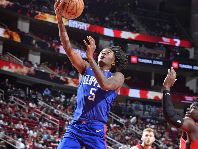 HOUSTON, TX - MARCH 6: Bones Hyland #5 of the LA Clippers drives to the basket during the game against the Houston Rockets on March 6, 2024 at the Toyota Center in Houston, Texas. NOTE TO USER: User expressly acknowledges and agrees that, by downloading and or using this photograph, User is consenting to the terms and conditions of the Getty Images License Agreement. Mandatory Copyright Notice: Copyright 2024 NBAE (Photo by Logan Riely/NBAE via Getty Images)