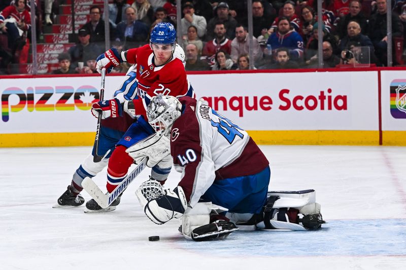 Jan 15, 2024; Montreal, Quebec, CAN; Colorado Avalanche goalie Alexandar Georgiev (40) makes a save against Montreal Canadiens left wing Juraj Slafkovsky (20) during the third period at Bell Centre. Mandatory Credit: David Kirouac-USA TODAY Sports