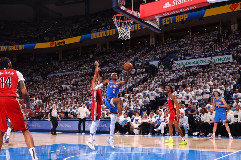 OKLAHOMA CITY, OK - APRIL 24: Shai Gilgeous-Alexander #2 of the Oklahoma City Thunder drives to the basket during the game against the New Orleans Pelicans during Round 1 Game 2 of the 2024 NBA Playoffs on April 24, 2024 at Paycom Arena in Oklahoma City, Oklahoma. NOTE TO USER: User expressly acknowledges and agrees that, by downloading and or using this photograph, User is consenting to the terms and conditions of the Getty Images License Agreement. Mandatory Copyright Notice: Copyright 2024 NBAE (Photo by Zach Beeker/NBAE via Getty Images)