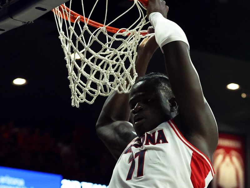 Jan 4, 2024; Tucson, Arizona, USA; Arizona Wildcats center Oumar Ballo (11) makes a basket against the Colorado Buffaloes during the second half at McKale Center. Mandatory Credit: Zachary BonDurant-USA TODAY Sports