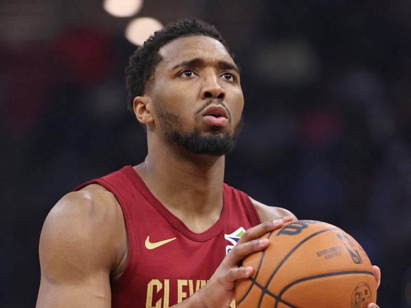 CLEVELAND, OH - FEBRUARY 23: Donovan Mitchell #45 of the Cleveland Cavaliers shoots a free throw during the game against the Memphis Grizzlies on February 23, 2025 at Rocket Arena in Cleveland, Ohio. NOTE TO USER: User expressly acknowledges and agrees that, by downloading and/or using this Photograph, user is consenting to the terms and conditions of the Getty Images License Agreement. Mandatory Copyright Notice: Copyright 2025 NBAE (Photo by Joe Murphy/NBAE via Getty Images)