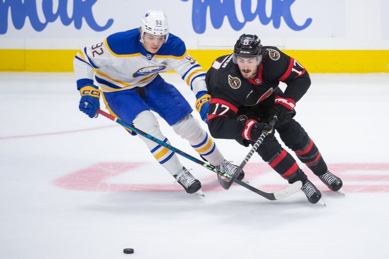 Sep 26, 2024; Ottawa, Ontario, CAN; Buffalo Sabres center Anton Wahllberg (92) battles with Ottawa Senators right wing Zack MacEwen (17) in the third period at the Canadian Tire Centre. Mandatory Credit: Marc DesRosiers-Imagn Images