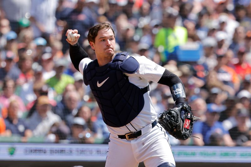 May 25, 2025; Detroit, Michigan, USA;  Detroit Tigers catcher Dillon Dingler (13) makes a throw to first for an out in the third inning against the Cleveland Guardians at Comerica Park. Mandatory Credit: Rick Osentoski-Imagn Images