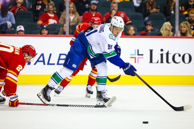 Sep 28, 2024; Calgary, Alberta, CAN; Vancouver Canucks right wing Daniel Sprong (91) controls the puck against the Calgary Flames during the third period at Scotiabank Saddledome. Mandatory Credit: Sergei Belski-Imagn Images