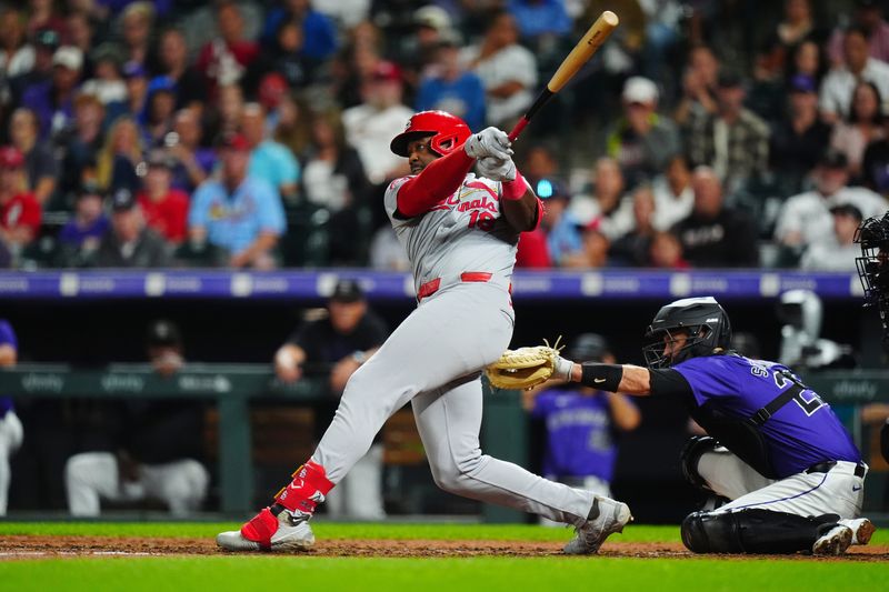 Sep 24, 2024; Denver, Colorado, USA; St. Louis Cardinals right fielder Jordan Walker (18) hit an RBI single in the eighth inning against the Colorado Rockies at Coors Field. Mandatory Credit: Ron Chenoy-Imagn Images