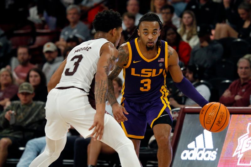 Feb 8, 2023; Starkville, Mississippi, USA; LSU Tigers guard Justice Hill (3) dribbles as Mississippi State Bulldogs guard Shakeel Moore (3) defends during the second half at Humphrey Coliseum. Mandatory Credit: Petre Thomas-USA TODAY Sports