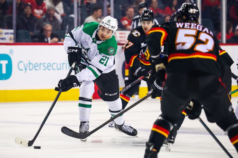 Mar 3, 2026; Calgary, Alberta, CAN; Dallas Stars left wing Jason Robertson (21) controls the puck against the Calgary Flames during the first period at Scotiabank Saddledome. Mandatory Credit: Sergei Belski-Imagn Images