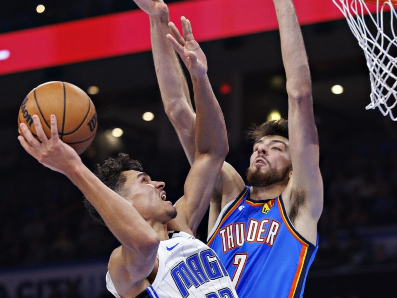 OKLAHOMA CITY, OKLAHOMA - NOVEMBER 4: Tristan da Silva #23 of the Orlando Magic goes to the basket in the second half against Chet Holmgren #7 of the Oklahoma City Thunder at Paycom Center on November 4, 2024 in Oklahoma City, Oklahoma. NOTE TO USER: User expressly acknowledges and agrees that, by downloading and or using this Photograph, user is consenting to the terms and conditions of the Getty Images License Agreement. The Thunder defeated the Magic 102-86.  (Photo by Wesley Hitt/Getty Images)