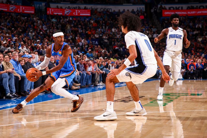 OKLAHOMA CITY, OK - NOVEMBER 4:  Shai Gilgeous-Alexander #2 of the Oklahoma City Thunder handles the ball during the game against the Orlando Magic on November 4, 2024 at Paycom Center in Oklahoma City, Oklahoma. NOTE TO USER: User expressly acknowledges and agrees that, by downloading and or using this photograph, User is consenting to the terms and conditions of the Getty Images License Agreement. Mandatory Copyright Notice: Copyright 2024 NBAE (Photo by Zach Beeker/NBAE via Getty Images)