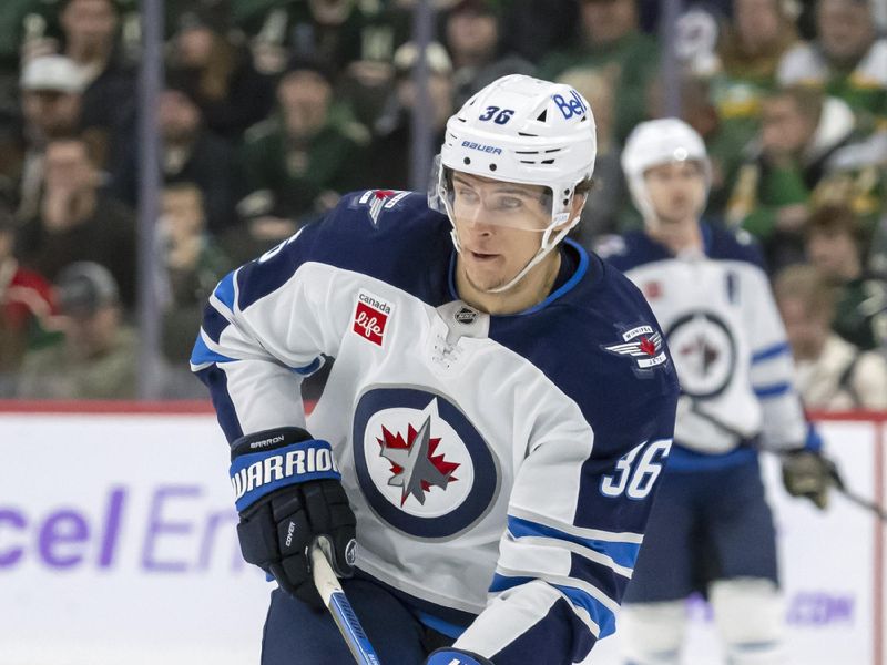 Nov 25, 2024; Saint Paul, Minnesota, USA;  Winnipeg Jets forward Morgan Barron (36) skates with the puck against the Minnesota Wild during the third period at Xcel Energy Center. Mandatory Credit: Nick Wosika-Imagn Images