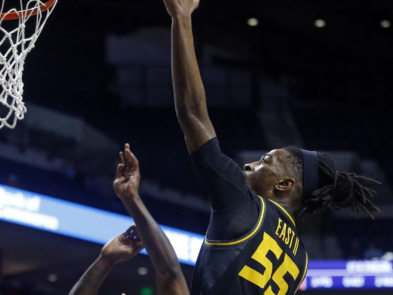 Jan 24, 2023; Oxford, Mississippi, USA; Missouri Tigers guard DeAndre Gholston (4) drives to the basket as Mississippi Rebels guard James White (5) defendsduring the first half at The Sandy and John Black Pavilion at Ole Miss. Mandatory Credit: Petre Thomas-USA TODAY Sports