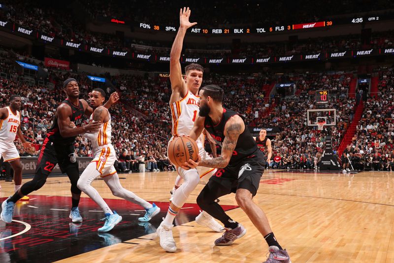 MIAMI, FL - JANUARY 19: Bogdan Bogdanovic #13 of the Atlanta Hawks plays defense during the game against the Miami Heat on January 19, 2024 at Kaseya Center in Miami, Florida. NOTE TO USER: User expressly acknowledges and agrees that, by downloading and or using this Photograph, user is consenting to the terms and conditions of the Getty Images License Agreement. Mandatory Copyright Notice: Copyright 2024 NBAE (Photo by Issac Baldizon/NBAE via Getty Images)