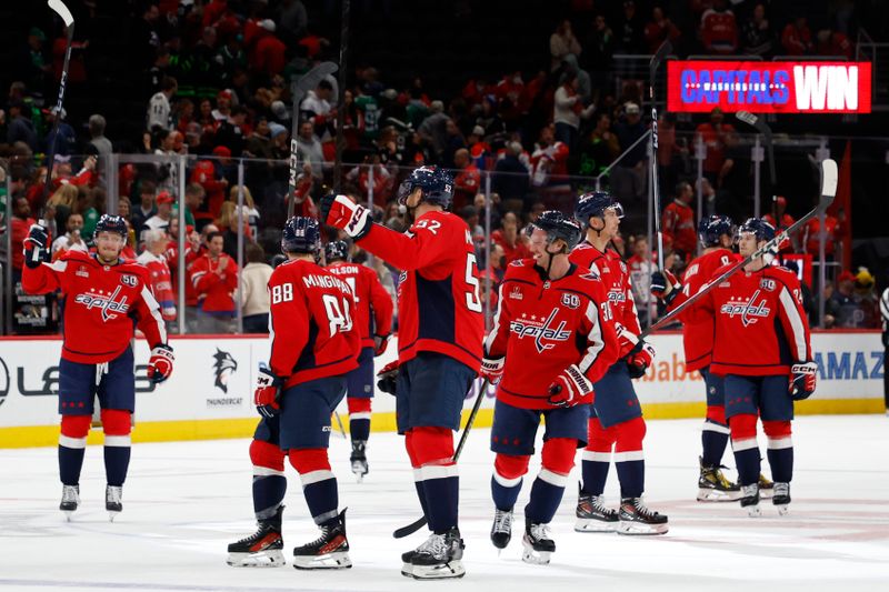 Oct 17, 2024; Washington, District of Columbia, USA; Washington Capitals players salute the fans after their game against the Dallas Stars at Capital One Arena. Mandatory Credit: Geoff Burke-Imagn Images